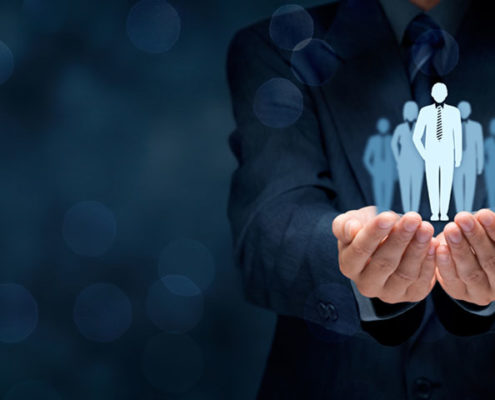 Manager holding figures in hands
